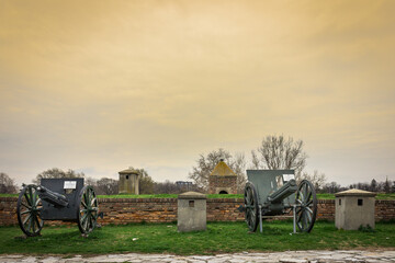 Historical cannons in outdoor military museum showcase in Kalemegdan fortress in Belgrade during golden hour