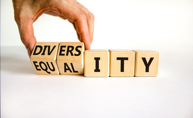 Diversity and equality symbol. Businessman turns wooden cubes and changes the word 'equality' to 'diversity'. Beautiful white background. Business, diversity and equality concept. Copy space.