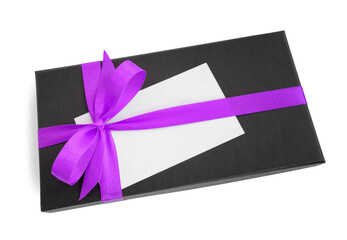 Black gift box (present) with purple satin ribbon bow and a blank card with copy space, isolated on white background