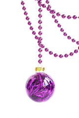 Purple glass Christmas bauble hanging on a violet bead garland, isolated on white