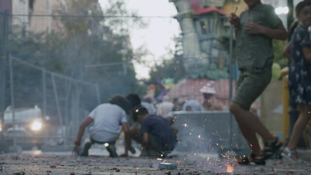 Children throw firecrackers on the streets