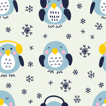 Hand drawn winter penguins with snowflakes seamless pattern. Perfect for T-shirt, textile and prints. Doodle style vector illustration for decor and design.
