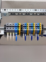 Multi-level pass-through terminals for connecting electrical wires.