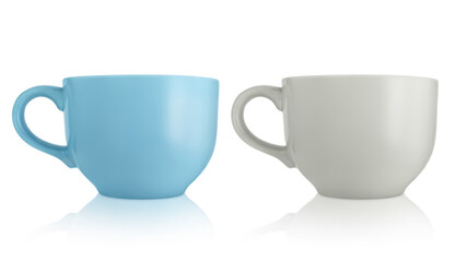 Ceramic cups. Two large empty ceramic mug isolated on white background. Mugs with a handle. Gray and blue cups.