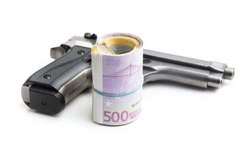 Hand gun and euro banknotes.