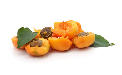 Apricots and pits with leaves.