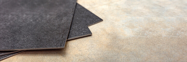 Vinyl PVC floor. The texture of the vinyl floor is black. Samples of vinyl covering, black pvc...