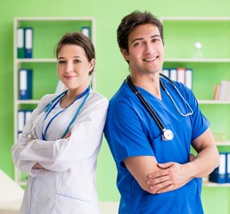 Woman and man doctors radiologists working at the clinic