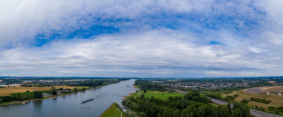 Fototapeta na wymiar Panoramic view of the Rhine river near Leverkusen, Germany. Drone photography