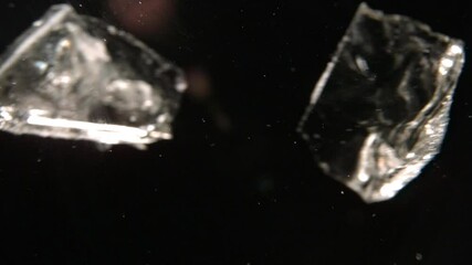 Ice Moving Across Screen In Black Space. Ice Falling And Bouncing. VFX Plate For Texture.  Dark Background In Slow Motion - Powered by Adobe