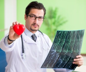 Doctor radiologist looking at x-ray scan in hospital