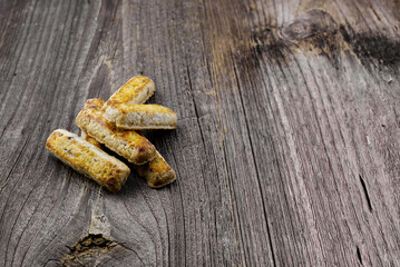 Traditional Swiss nut sticks on dark wood with copy space