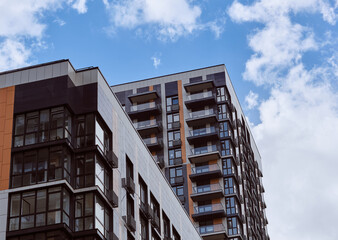 Modern modern residential skyscraper and beautiful blue sky and bright white clouds. 