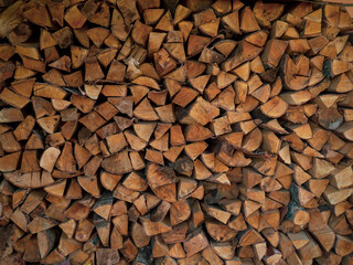Firewood texture. Pile of dry chopped fire wood background