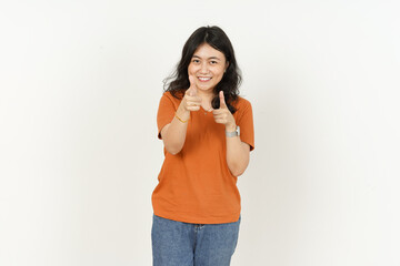 Pointing At You of beautiful asian woman Wearing orange T-shirt isolated on white background