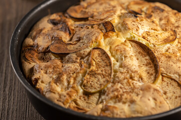 Homemade oven baked apple pie in metal baking bowl
