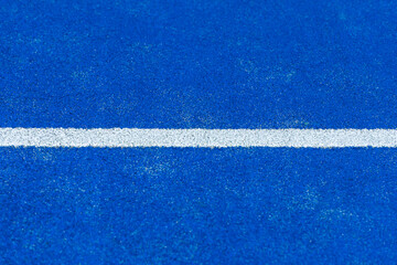 Blue paddle tennis court. Blue court with white lines. Horizontal sport poster, greeting cards, headers, website.