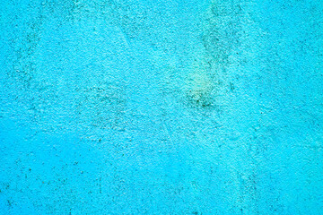 Fototapeta na wymiar Vivid neon bright blue painted house wall, exterior or interior decoration, with texture and large empty text space.