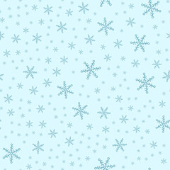 Seamless pattern of snowflakes on a blue background