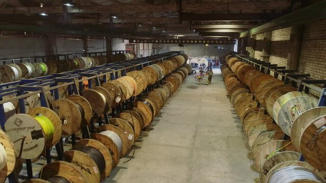 Coils with cable in stock, warehouse with coils with cable. Cable factory