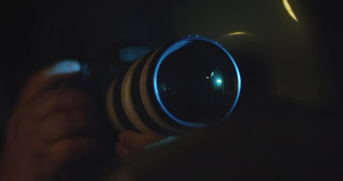 Spy, Paparazzi or Detective in the Car, Shooting On Camera. Night Time Stalking, Long Lens, Secretive Photography