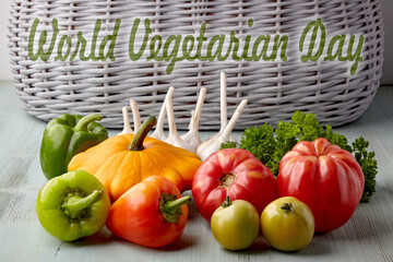 Ripe vegetables and herbs from the garden on a wooden blue table