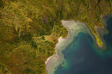Amazing landscape of green coast and blue lagoon