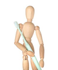 Wooden mannequin with toothbrush on white background