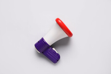 Toy megaphone on light background