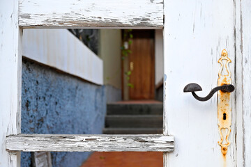 A gate to an old villa, old lock and door handle detail.