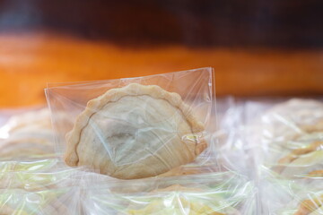 Curry puffs in plastic bag package with close up shot.