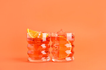 Glasses of tasty Negroni cocktail on color background