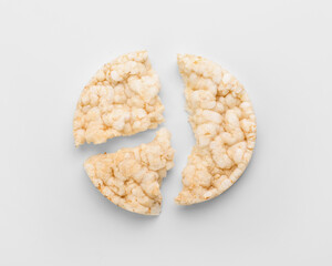 Broken rice cracker on white background