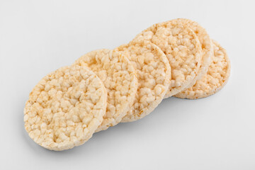 Puffed corn crackers on white background