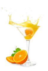 Glass of tasty orange margarita with splashes on white background