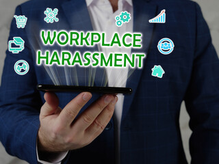  WORKPLACE HARASSMENT text in search line. Budget analyst looking for something at computer....