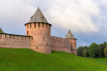 Fototapeta na wymiar Red brick fortress walls of Kremlin of Novgorod. Veliky Novgorod