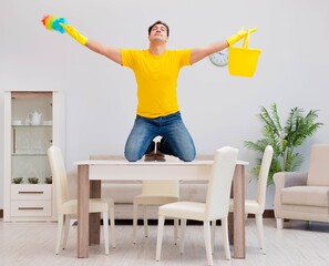 Man husband cleaning the house helping his wife