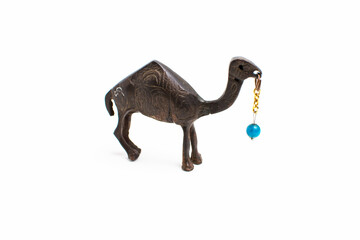 camel souvenir with a bead on a white background.