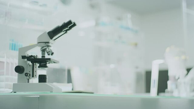Empty laboratory interior with microscopes and computer