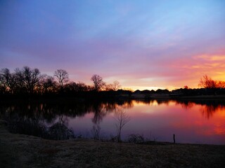 Sunset by the lake on a winter day