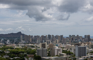 Fototapeta na wymiar Scenic aerial Honolulu vista with the Diamond Head in the background on a rainy day, Oahu, Hawaii