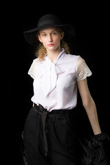 Fashion girl teenager in stylish outfit and hat