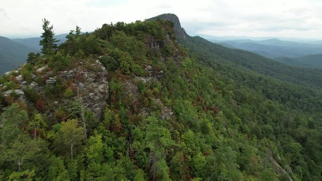 aerial reveal of table rock mountain and hawksbill mountain from just outside the linville gorge wilderness area boundaries
