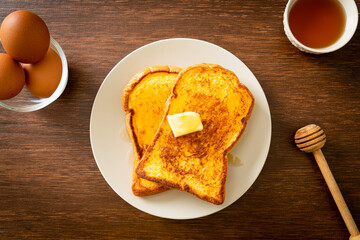 French toasted with butter and honey