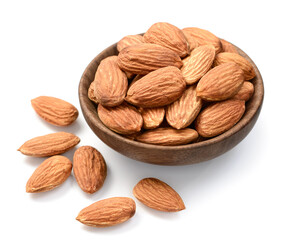 almond nuts in the wooden bowl, isolated on the white background