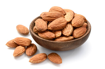 almond nuts in the wooden bowl, isolated on the white background
