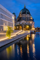 Fototapeta premium The Berlin Cathedral and the modern backside of the City Palace at night