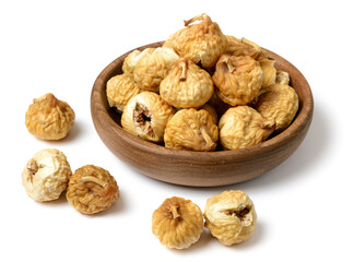 close up of dried fig fruits in the wooden bowl, isolated on the white background
