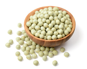 uncooked dried green peas in the wooden bowl, isolated on the white background